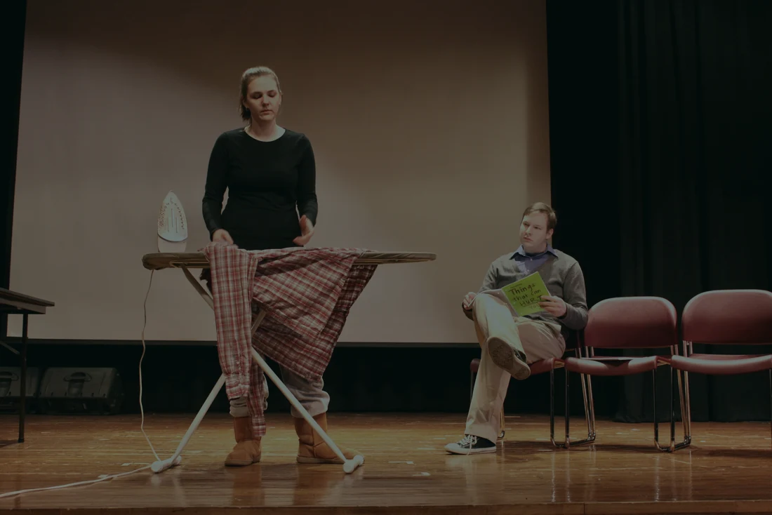 A performer reads sides to camera while a scene partner reads opposite them off-camera in a home studio setup